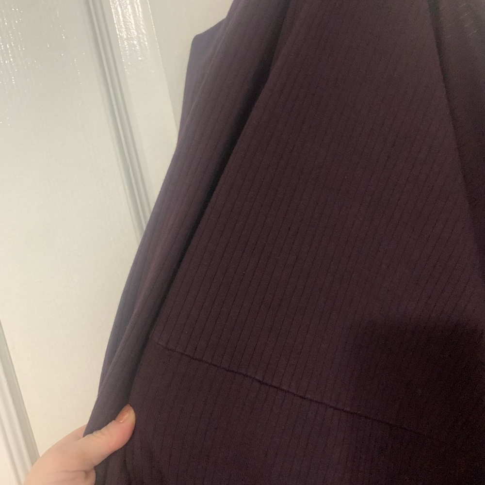 Super comfy plum dress, longer in the back with tie detail at the bottom